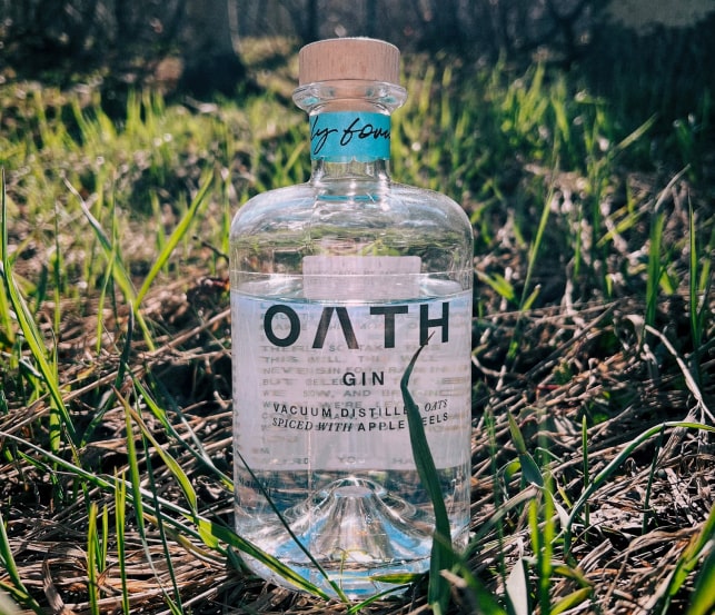 Photo of a bottle of Oath gin in nature